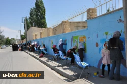 دست های کوچک اعضای کانون پرورش فکری کودک و نوجوان در زیباسازی دیوار بیرونی پردیس